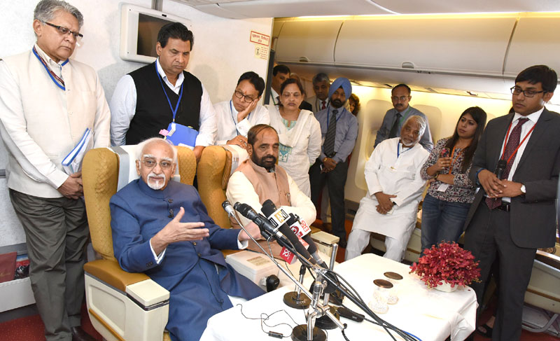 The Vice President, Mr. M. Hamid Ansari interacting with the accompanying media delegation on board, Air India Special aircraft on his way to Morocco and Tunisia visit, on May 30, 2016. The Minister of State for Chemicals & Fertilizers, Mr. Hansraj Gangaram Ahir is also seen.