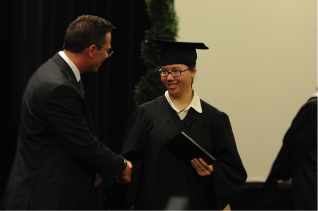 Provost Academy Colorado Student of the Year Taylor Willingham receives her diploma.