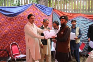 CHITRAL:   Divisional Forest officer Muhammad Saleem Marwat  giving away certificate to participant of training on the eve of  6 days training workshop on capacity building  of wild life staff and community representatives in rules and Regulation  under KP wildlife and Biodiversity Act 2015  photos by Gul Hamad Farooqi