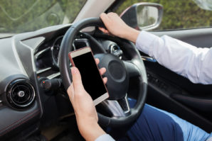 Businessman Checking Phone While Careless Driving - Distraction